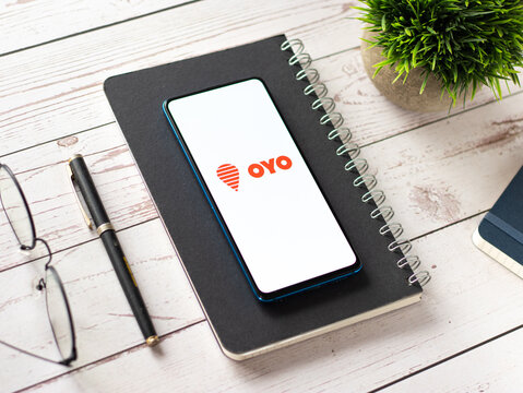 Assam, India - August 6, 2021 : Oyo logo on phone screen stock image.