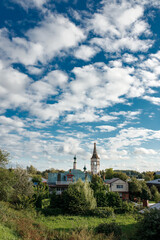 Summer Landscape of the city of Suzdal With a White Orthodox Church and wooden houses