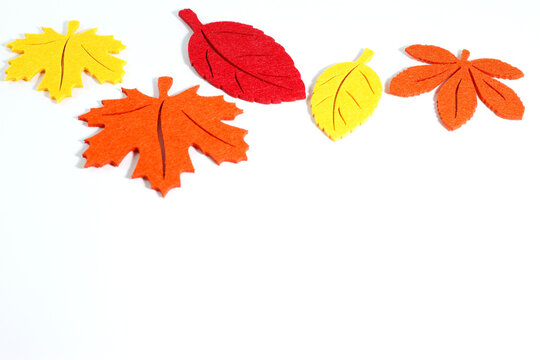 Yellow orange red autumn leaves, border frame, artificial plant, fall plant 