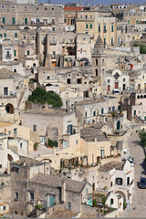 Fototapeta na wymiar Matera, Italy - August 17, 2020: View of the Sassi di Matera a historic district in the city of Matera, well-known for their ancient cave dwellings. Basilicata. Italy