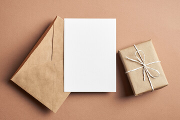 Invitation or greeting card mockup with envelope and gift box