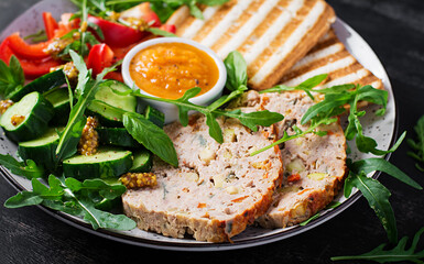 Chicken meatloaf and fresh salad and toasts. Healthy lunch or dinner.