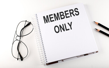 Notepad with text MEMBERS ONLY . White background. Business concept