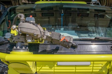 International airport rescue fire truck. Cockpit and windshield close-up with water cannon and foam...