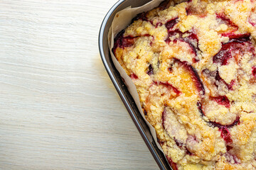 plum cake with sugar crumbs texture close-up top view