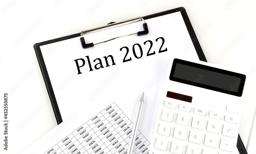 Poster plan 2022 text on folder with chart and calculator on white background
