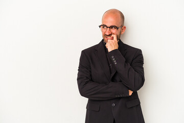 Young business bald man isolated on white background  relaxed thinking about something looking at a copy space.