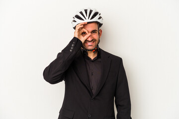 Young business bald man wearing a bike helmet isolated on white background  excited keeping ok gesture on eye.