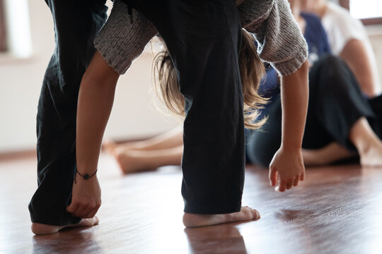 two dancers move in contact improvisation performance