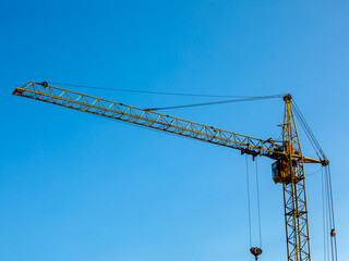 construction site with cranes against the background of new buildings