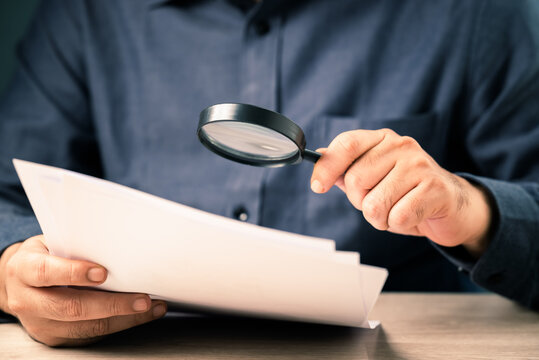 Businessman Magnify the Documents
