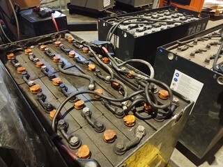 Industrial storage batteries. Charging the battery of the electric forklift.