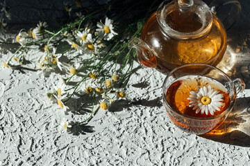 herbal tea with chamomile on a light background