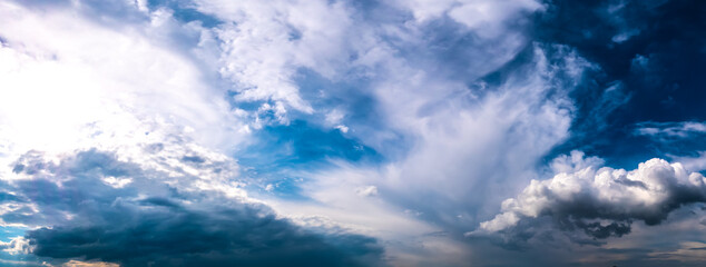 Panorama landscape of sky. Dramatic blue sky with fluffy clouds.