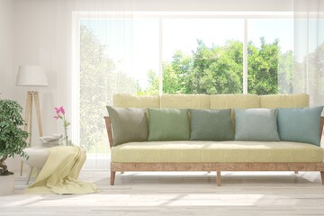 White living room with sofa and summer landscape in window. Scandinavian interior design. 3D illustration