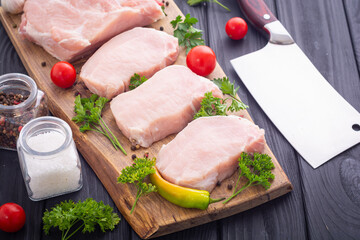 Raw pork fillet with spices and herbs