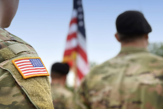 US Soldiers. US Army. USA Patch Flag On The US Military Uniform. Soldiers On The Parade Ground From The Back. Veterans Day. Memorial Day.