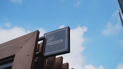 Outdoors Smoking Room at The Business Center Marked with a Cigarette Sign	
