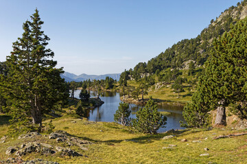 The shores of Achard Lake in Chamrousse resort, Belledonne range, French Alps