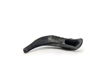 Obraz premium Shofar ( horn ) on a white background with space for text. A rams horn used to blow sounds on the Jewish new year Rosh Ha Shana