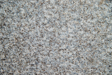 The texture of gray marble. Small drawing on the stone floor.