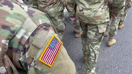 Soldiers marching on the parade. US army. Military forces of the United States of America. Veterans Day. - Powered by Adobe
