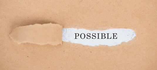 The word possible is standing on a white background, ripped paper