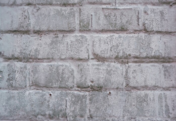 texture of old brickwork painted with gray paint. Weathered background. background consisting of horizontal part of gray painted brick wall.