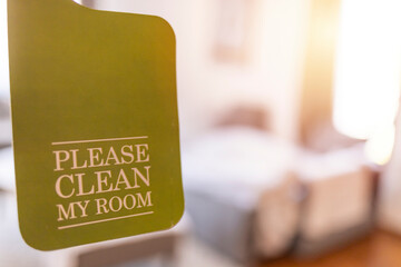 Please make up my room. Maid cleaning the room with please make up my room sign on the door. Opened door of hotel room in morning.Hotel, door open. Clean and elegant accommodation service.