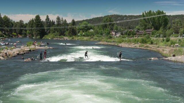 Aerial: People surfing on the Deschutes River at the Bend Whitewater Park, Bend, Oregon