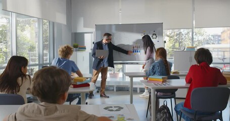 African teen girl student and teacher having presentation in classroom about environment - Powered by Adobe