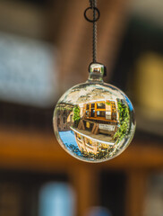 A glass ball in which we see the reflection of nearby buildings. We can also put it on the Christmas tree.


