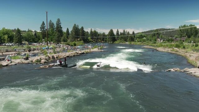 Aerial: People surfing on the Deschutes River at the Bend Whitewater Park, Bend, Oregon