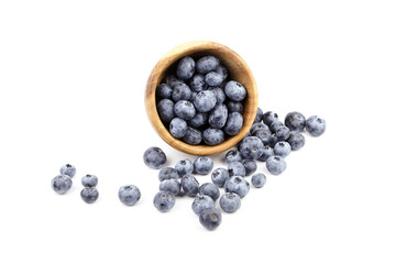 Blueberry in wooden bowl isolated on white background