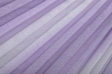 Fototapeta na wymiar shiny purple textile background, violet pleated cloth as creative backdrop, lilac beautiful bright material, colour of fabric, striped cloth