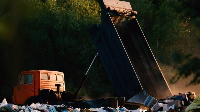 Truck at the garbage dump. Ecology theme.