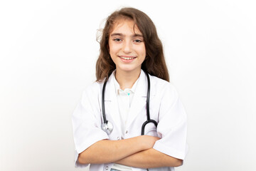 Fototapeta premium Portrait of a cute little girl dressed as a doctor with a stethoscope.