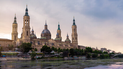 Fototapeta na wymiar Cathedral Basilica of Our Lady of Pillar and Ebro river at sunset of Zaragoza