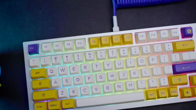 footage of a premium custom keyboard build kit with full alluminium base and bright RGB LED Colors