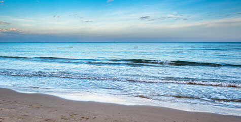 Panorama of the beaches of laicante without people on a summer day in spain enjoying the views of the sea and the sound of the waves.