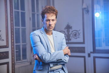 Pensive man in suit in luxury room