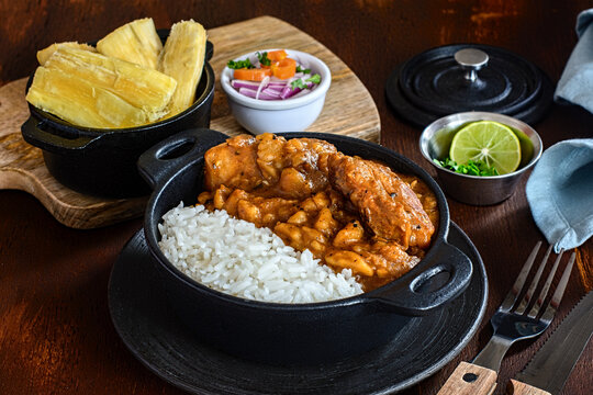 Carapulcra with cooked rice and stewed meat pieces in pot