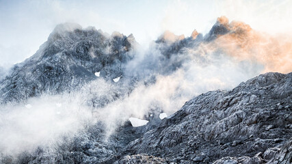 Clouds in the mountains with snow and beautiful light, Picos de Europa
