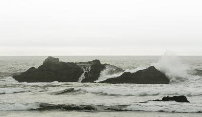 waves crashing on sea rocks