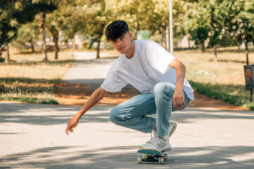 teenage boy with skateboard on the street