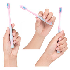 Hand holding Set of toothbrush isolated on a white background.