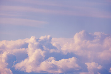 Naklejka na ściany i meble Fluffy clouds background on soft blue sky, copy, space