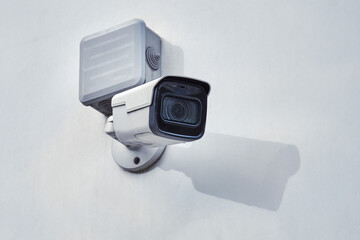 Video surveillance camera on the building, monitoring the security of a residential house