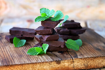 Mint chocolate. Dark chocolate with fresh mint leaves. Organic food.