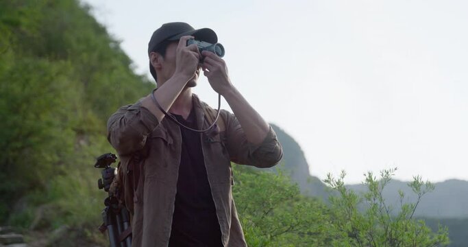 Photographer taking photos outdoors,4K